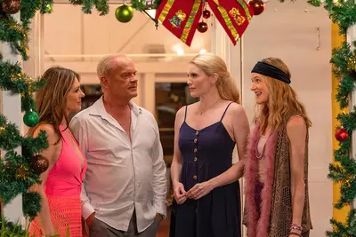 CHRISTMAS IN PARADISE, from left: Elizabeth Hurley, Kelsey Grammer, Nathalie Cox, Naomi Frederick, 2022. © Lionsgate Home Entertainment /Courtesy Everett Collection