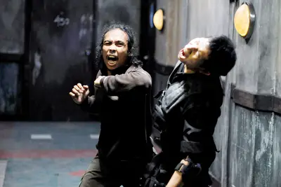 THE RAID: REDEMPTION, (aka THE RAID, aka SERBUAN MAUT), from left: Yayan Ruhian, Eka Rahmadia, 2011. ph: Akhirwan Nurhaidir/©Sony Pictures Classics/Courtesy Everett Collection