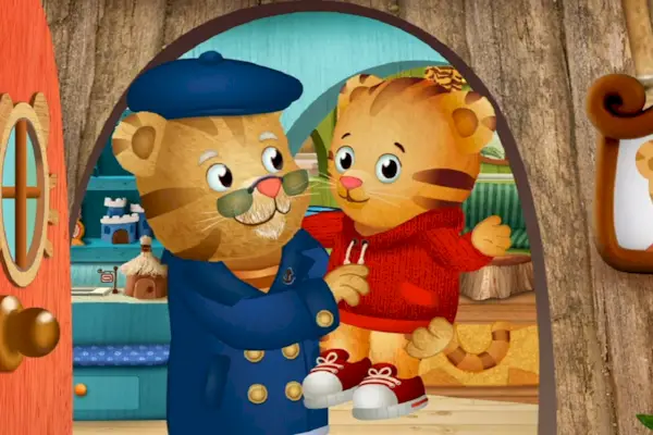 Illustration von Daniel Tiger, der seinen Vater, Daniel Striped Tiger, in ihrem Haus umarmt.