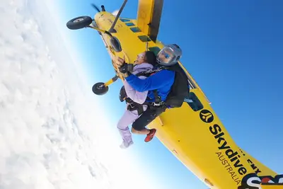 Jenn Tran jumping out of a plane on 