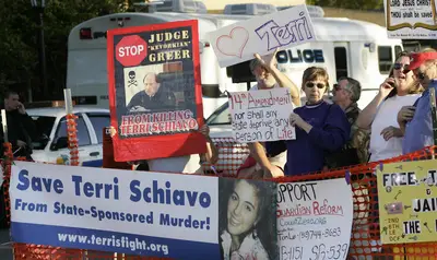  Pro-life activists hold up signs calling to keep Terri Schiavo alive 19 March 2005 
