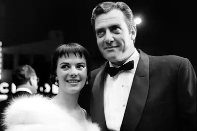 LOS ANGELES,CA - AUGUST 17,1956: Actress Natalie Wood with actor Raymond Burr attend the premiere of 
