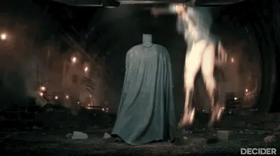 Wonder Woman leaps down and her skirt swings up a little, revealing her butt at bit.