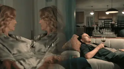 SUGAR EPISODE 5 COOL SHOT WITH THE DUAL ANNA GUNS IN THE REFLECTIVE GLASS AND DAVID ON THE COUCH IN THE BACKGROUND