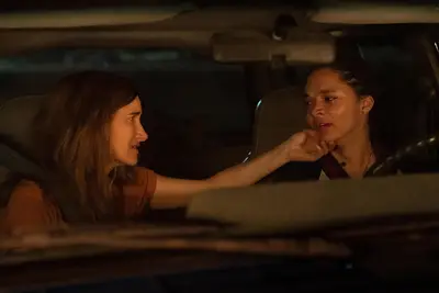 Clare (Kathryn Hahn) comforting Rae (Tanzyn Crawford) in 
