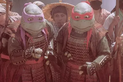 Still from Teenage Mutant Ninja Turtles III showing Donatello and Raphael,