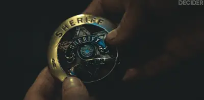 SILO Episode 3 FLIPPING OVER THE BADGE TO SEE THE WORD TRUTH