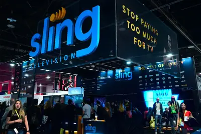 Sling TV on a billboard with people underneath.