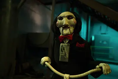 A creepy puppet version of Jigsaw in SAW X