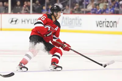 New Jersey Devils center Jack Hughes (86) skates with the puck during a preseason game