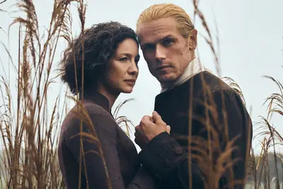 Caitriona Balfe and Sam Heughan in an Outlander portrait