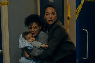 Detective Lenker, Carla, and a baby on 